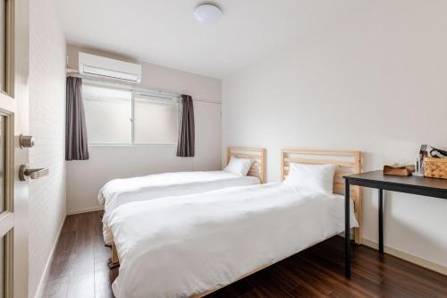 Postel nebo postele na pokoji v ubytování エルドラード - Apartment stay
