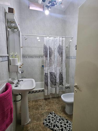 a bathroom with a sink and a toilet and a shower at Finca Don Celestino in La Banda