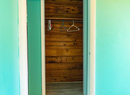 a room with a wooden door with a hanger at GpL 2668 one bedroom in Fort Myers