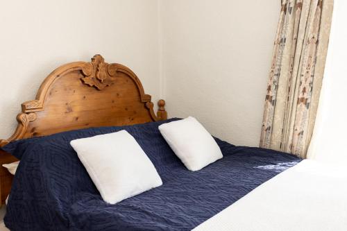 Un ou plusieurs lits dans un hébergement de l'établissement Springwell Inn