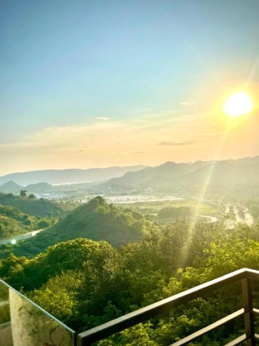 a view of a valley with the sun in the sky at Truntum Boutique Mandalika in Kuta Lombok