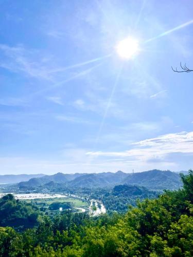 a view of a valley with the sun in the sky at Truntum Boutique Mandalika in Kuta Lombok