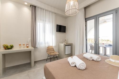 TV a/nebo společenská místnost v ubytování Plaka Hotel I