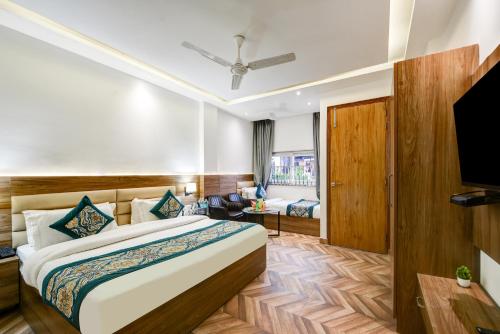 Cama o camas de una habitación en The Sunrise Vista Near Nizamuddin Railway Station