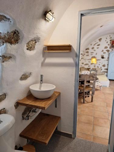 a bathroom with a sink on a wall at Kalokairines Serenity House in Kalokairinoí
