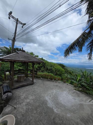 a gazebo with a view of the ocean at Simoy Staycation Tagaytay in Tagaytay
