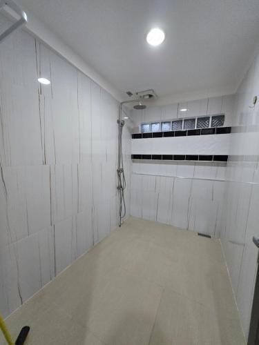 an empty garage with a shower in it at Simoy Staycation Tagaytay in Tagaytay