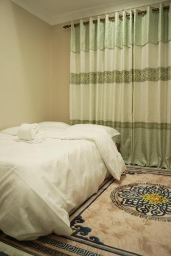 Katil atau katil-katil dalam bilik di 2 BHK Apartment Homestay in Kathmandu