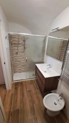 a bathroom with a toilet and a sink and a shower at AL BELVEDERE in Acerenza