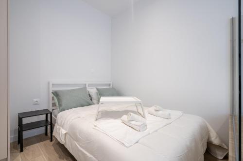 Ένα ή περισσότερα κρεβάτια σε δωμάτιο στο Cute apartment with jacuzzi