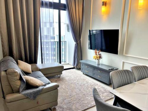 a living room with a couch and a tv at HYDE1 i-City ITQAN Premium Home - 8pax, Netflix, Parking in Shah Alam