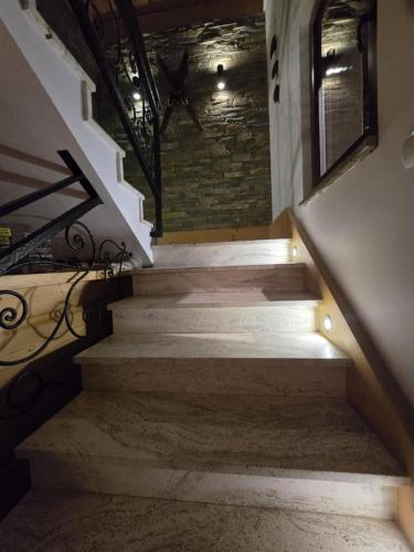 a set of stairs in a building with lights at Chocholowska Zohylina pokoje in Chochołów