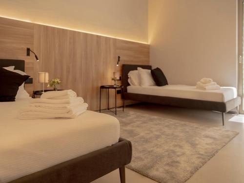 Postel nebo postele na pokoji v ubytování villa degli ulivi salento design resort