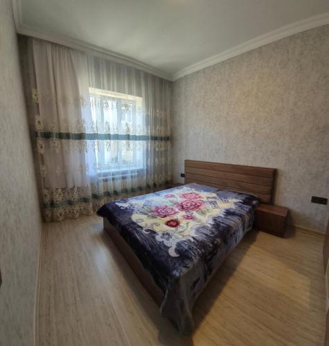 Katil atau katil-katil dalam bilik di Townhouse in Qusar