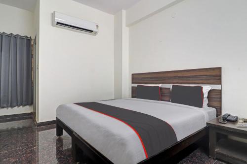 Ένα ή περισσότερα κρεβάτια σε δωμάτιο στο Collection O SS Metro Ritz