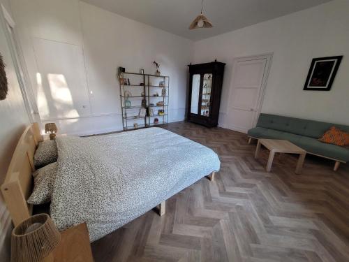Katil atau katil-katil dalam bilik di Appartement de charme dans une maison de maître