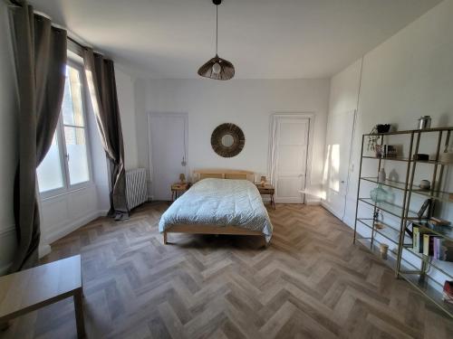 Katil atau katil-katil dalam bilik di Appartement de charme dans une maison de maître