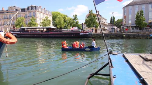 a group of people in a small boat in the water at Le gîte embarqué - Géré par Presta-Zen'Services - Barque électrique en supplément in Verdun