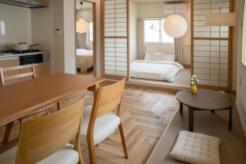 a kitchen and living room with a table and chairs at 大田Nishikōjiya hotel-OT0368 in Tokyo