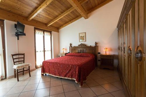 Postel nebo postele na pokoji v ubytování Agriturismo Daniela