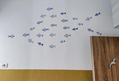 a group of butterflies on the wall of a bathroom at OstiaByTheSeaCozyBedroom in Lido di Ostia