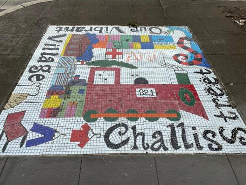 a mosaic rug on a sidewalk with the words christmas at Studio 59 Newport sleeps1 in Newport
