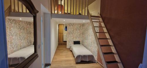 a hallway with two bunk beds and a staircase at Sunset Villa atypical with air conditioning in Nice