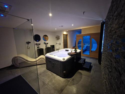 a large bathroom with a tub and a shower at Nuit Blanche Normandie in Eu