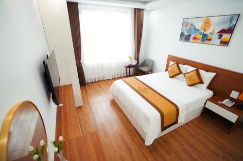 Ένα ή περισσότερα κρεβάτια σε δωμάτιο στο Realux Hotel