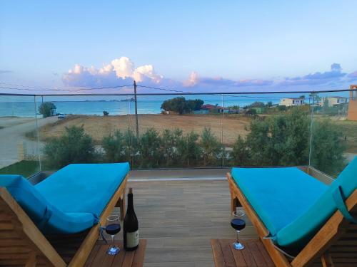 a balcony with a view of the ocean at BlueTel Lixouri in Lixouri