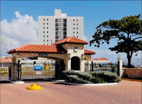 a gazebo with a building in the background at Bayfront Luxury beachfront escape with Pool in Portmore Book Now in Portmore