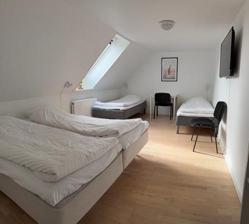 Postel nebo postele na pokoji v ubytování Guesthouse Hune