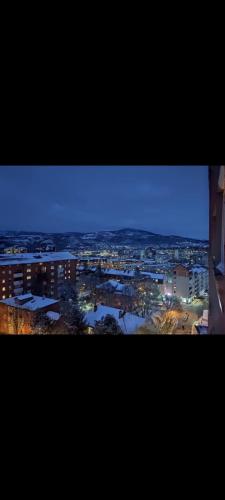 a view of a city at night with lights at Nikolas apartment in Mitrovicë