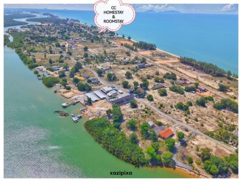 an aerial view of a house on an island in the water at CC HOMESTAY PRIVATE POOL Kampung Mangkuk, Terengganu in Penarek