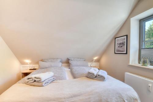 Ένα ή περισσότερα κρεβάτια σε δωμάτιο στο Ferienwohnung Wandashorst 25 Feriendorf Klein Stresow Rügen by ruyastay