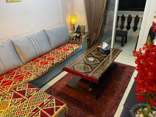 a living room with a couch and a table at Chalet in Belagio Ain Sokhna in Ain Sokhna