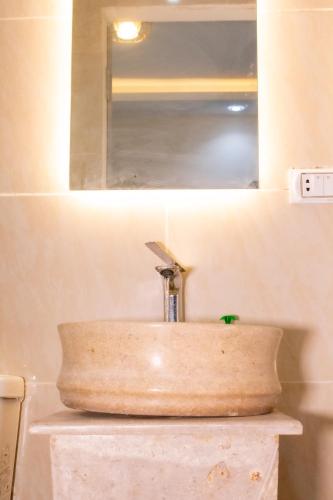 a sink with a faucet on top of a counter at Pyramids sun set view in Cairo