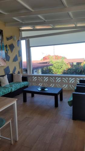a living room with a couch and a table at Finca Maradentro - private pool and jacuzzi with ocean view in Arafo