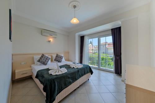 Postel nebo postele na pokoji v ubytování Villa Gül, Fethiye