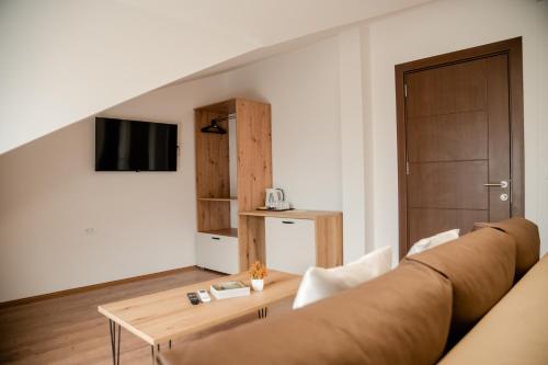 a living room with a couch and a table at Villa Petra in Ohrid
