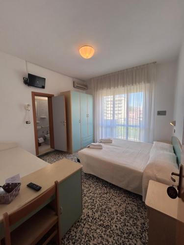 Postel nebo postele na pokoji v ubytování Hotel Letizia