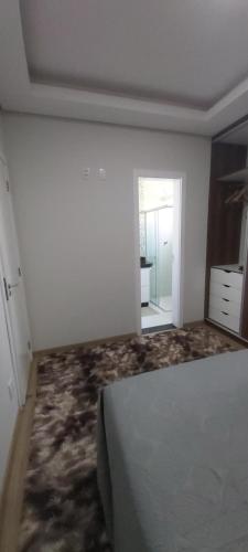 Katil atau katil-katil dalam bilik di Apartamento Completo com garagem - Diamantina