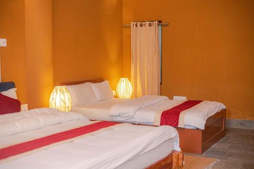 Cama o camas de una habitación en Santih Pala- by Jungle Adventure World Hotel