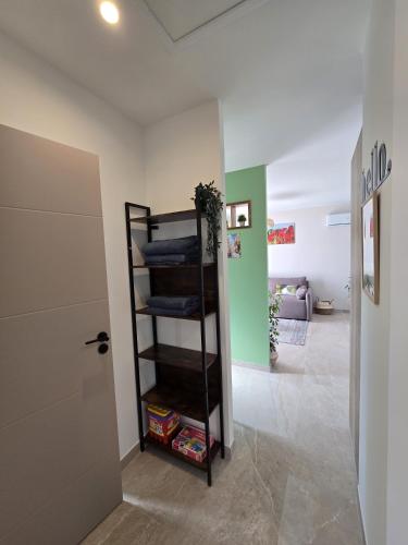 a room with a shelf with folded towels at Cocoon Luberon in Lauris