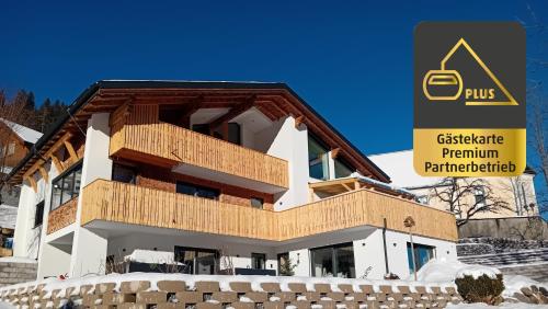 a building under construction with a sign in front of it at 12er Residence in Bürserberg
