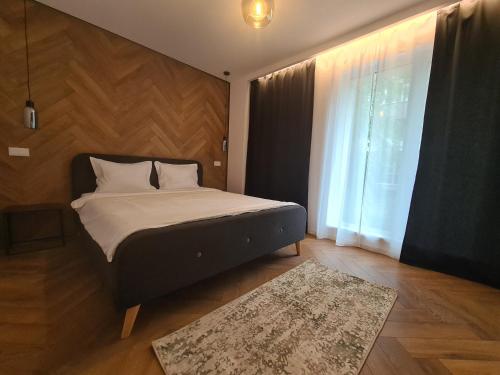 Ένα ή περισσότερα κρεβάτια σε δωμάτιο στο Arena Park