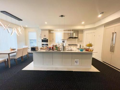 a large kitchen with a island in a room at Morning Dew105 in Hammonds Plains