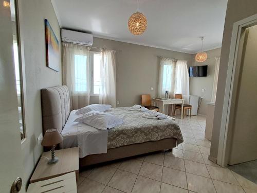 Ένα ή περισσότερα κρεβάτια σε δωμάτιο στο Sigma Hotel