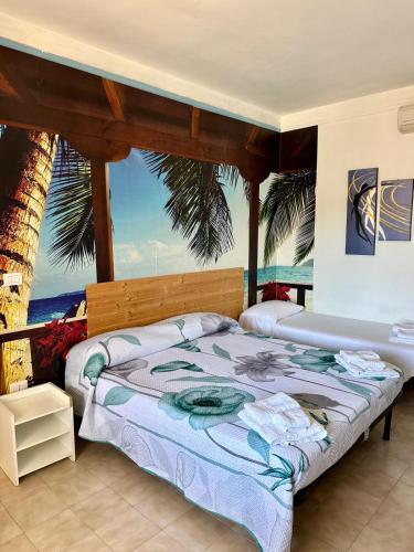 a bedroom with two beds and a view of the ocean at Case Vacanze Racale in Racale