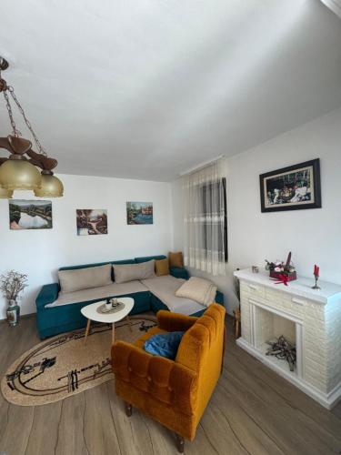 a living room with a couch and a fireplace at Magnolia in Ljubuški